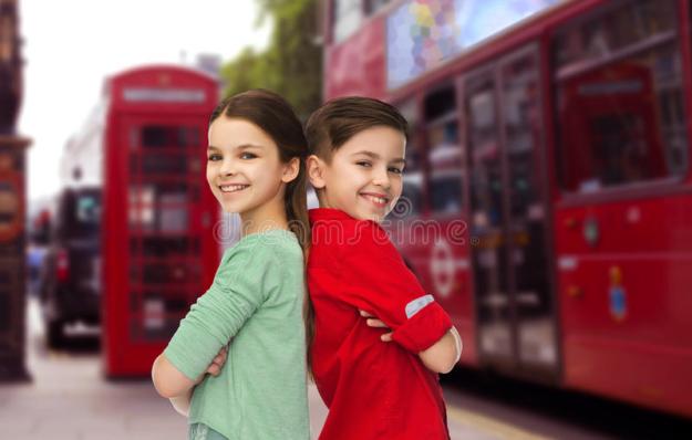 happy-boy-girl-standing-over-london-city-childhood-travel-tourism-people-concept-smiling-back-to-back-street-background-68435679